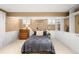 This bedroom features built-in shelves and a bed with a brass headboard at 843 Adams St, Denver, CO 80206