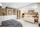 This bedroom offers built-in shelves, a bed with a brass headboard, and access to the living room at 843 Adams St, Denver, CO 80206
