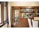 Dining room cabinet with glass display case and view to the living room at 843 Adams St, Denver, CO 80206