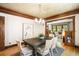 Well-lit dining room showcasing beautiful wood trim and a modern chandelier at 843 Adams St, Denver, CO 80206
