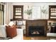 Living room fireplace with brick surround, mantle, and built-in bookshelves at 843 Adams St, Denver, CO 80206