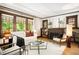 Cozy living room with hardwood floors, fireplace, and a comfortable seating arrangement at 843 Adams St, Denver, CO 80206