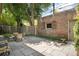 This patio is paved and has a table with four chairs at 843 Adams St, Denver, CO 80206