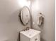 Chic powder room featuring a modern vanity with a vessel sink and stylish mirror at 9576 Deerhorn Ct # 50, Parker, CO 80134