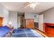 Bedroom featuring a wood frame bed, ceiling fan, closet, and natural light at 9576 Deerhorn Ct # 50, Parker, CO 80134