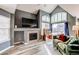 Living room featuring fireplace, ceiling fan and high ceilings at 9576 Deerhorn Ct # 50, Parker, CO 80134