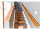 Wooden staircase with carpet runners and modern banister at 9576 Deerhorn Ct # 50, Parker, CO 80134