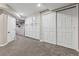 Finished basement featuring carpet, storage cabinets, a closet with sliding doors, and recessed lighting at 1328 Double Eagle Ct, Castle Rock, CO 80104