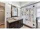 This bathroom features a glass enclosed shower, stylish tile accents, vessel sink and sleek hardware at 1328 Double Eagle Ct, Castle Rock, CO 80104