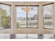 Bright breakfast nook with large windows, offering a view of the green space at 1328 Double Eagle Ct, Castle Rock, CO 80104