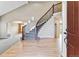 Open entryway features a winding staircase, hardwood floors, and leads to other living areas at 1328 Double Eagle Ct, Castle Rock, CO 80104