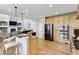 Modern kitchen featuring granite countertops, stainless steel appliances, and a breakfast bar at 1328 Double Eagle Ct, Castle Rock, CO 80104