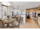 Bright kitchen with granite countertops, stainless steel appliances, a breakfast bar, and an adjacent breakfast nook at 1328 Double Eagle Ct, Castle Rock, CO 80104