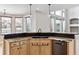 Stylish kitchen island featuring granite countertops, cabinets, and a black sink at 1328 Double Eagle Ct, Castle Rock, CO 80104