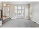 Bright living room featuring carpeted floors and large windows with white shutters at 1328 Double Eagle Ct, Castle Rock, CO 80104