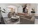 Elegant living room with high ceilings, a curved staircase, and neutral décor at 1328 Double Eagle Ct, Castle Rock, CO 80104