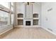 Living room features a fireplace, high ceilings, hardwood floors, and large windows at 1328 Double Eagle Ct, Castle Rock, CO 80104