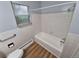 Cozy bathroom boasts a shower/tub, toilet, and window at 387 Tucson St, Aurora, CO 80011