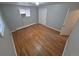Bedroom displaying hardwood floors, closet, neutral paint, and natural light at 387 Tucson St, Aurora, CO 80011