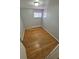 Bright bedroom features hardwood floors, neutral paint, and natural light from two windows at 387 Tucson St, Aurora, CO 80011