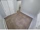 Carpeted bedroom featuring double closet with new paint and window for natural light at 387 Tucson St, Aurora, CO 80011