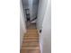 Inviting entryway with wood-look flooring, leading to a staircase and living areas at 387 Tucson St, Aurora, CO 80011