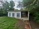 View of backyard enclosed porch with a large backyard at 387 Tucson St, Aurora, CO 80011