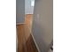 Hallway leading to rooms with hardwood floors at 387 Tucson St, Aurora, CO 80011