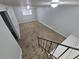View of the open-concept living room showcasing new carpet and natural light at 387 Tucson St, Aurora, CO 80011