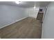 Spacious, open-concept living room with new carpet and built-in shelves at 387 Tucson St, Aurora, CO 80011