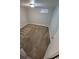 An empty room with neutral carpet and simple window covering awaits your personal touches at 387 Tucson St, Aurora, CO 80011