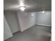 Spacious area has neutral walls, vinyl flooring, simple window covering and overhead lighting at 387 Tucson St, Aurora, CO 80011