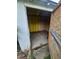 Interior of the backyard shed with yellow and white walls at 387 Tucson St, Aurora, CO 80011