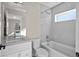 Contemporary bathroom with tub, shower combo, and white vanity at 2140 S Ash St # 101, Denver, CO 80222
