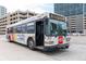 RTD bus at a stop on a street in front of a building at 2140 S Ash St # 101, Denver, CO 80222