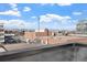 Scenic view from rooftop patio of the city and surrounding mountains at 2140 S Ash St # 101, Denver, CO 80222