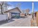 Spacious detached garage with artistic mural, adding character to the property at 4710 Pennsylvania St, Denver, CO 80216