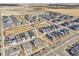 Aerial view of a modern residential community with homes, streets, and landscaping at 21411 E 60Th Ave, Aurora, CO 80019