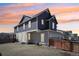 A spacious backyard featuring a well-maintained lawn and a wood fence surrounding the property at 21411 E 60Th Ave, Aurora, CO 80019