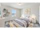 Cozy bedroom with natural light, playful decorations, and a comfortable rug on a gray carpet at 21411 E 60Th Ave, Aurora, CO 80019