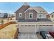 Rear exterior showcasing the garage, driveway and fenced yard at 21411 E 60Th Ave, Aurora, CO 80019