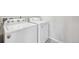 Laundry area showing the side-by-side washer and dryer at 21411 E 60Th Ave, Aurora, CO 80019
