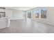 Bright and open living room with wood floors and lots of natural light from large windows at 21411 E 60Th Ave, Aurora, CO 80019