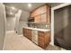 Stylish bar area features custom cabinets, modern appliances, and chic backsplash at 8378 Arapahoe Peak St, Littleton, CO 80125