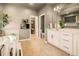 Bright bathroom featuring double vanity, walk-in closet, and modern decor at 8378 Arapahoe Peak St, Littleton, CO 80125