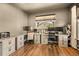 Bright home office featuring dual desk setup and ample storage at 8378 Arapahoe Peak St, Littleton, CO 80125