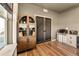 Home office showcasing wooden cabinet, built-in bench and hardwood floors at 8378 Arapahoe Peak St, Littleton, CO 80125