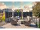 Stylish outdoor patio features comfortable seating, fire pit, and privacy screens at 8378 Arapahoe Peak St, Littleton, CO 80125