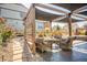 Relaxing backyard patio space featuring a pergola with an outdoor seating area perfect for entertaining at 8378 Arapahoe Peak St, Littleton, CO 80125