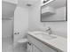 Modern bathroom with sleek vanity, marble floors, and minimalist design, featuring a tub at 4650 S Idalia St, Aurora, CO 80015